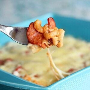 Mac N'Cheese in a fork from blue baking dish