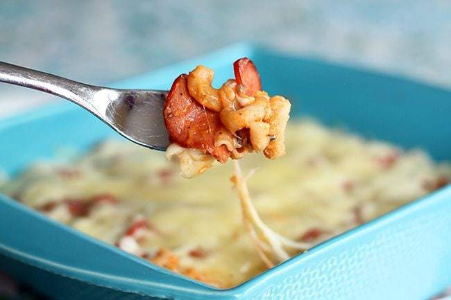 Mac N'Cheese in a fork from blue baking dish