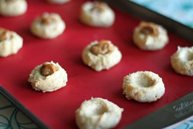 Cake Mix Cookie dough with caramel on top in a baking sheet 