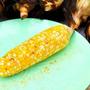 Curry & Honey Roasted Corn on the Cob With Husks in a Mint Green plate