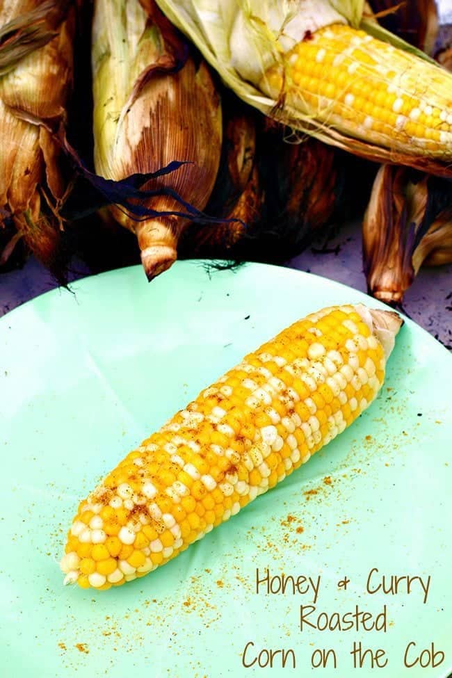 Curry & Honey BBQ Roasted Corn on a plate and with husks