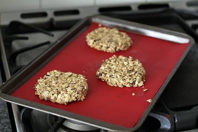 Breakfast Cookies dough pressed down thinly on a parchment lined baking sheet