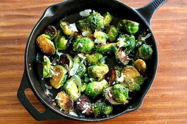 top down shot of Roasted Garlic Parmesan Brussels Sprouts in Skillet