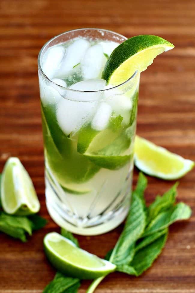 Close up of Mojito With Honey, garnish with mint leaves and lime wedges