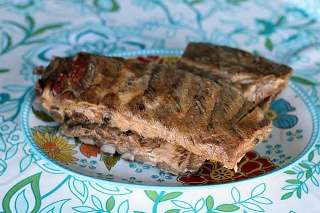 grilled ribs with BBQ flavor in a blue floral plate