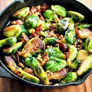 Large frying pan with bacon, walnuts and honey brussels sprouts with melted honey