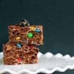 close up Chocolate Oreo & M&M Cereal Bars on a white cake holder