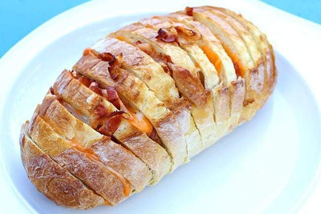 sliced Bacon and Cheese Pull Apart Loaf in a white plate