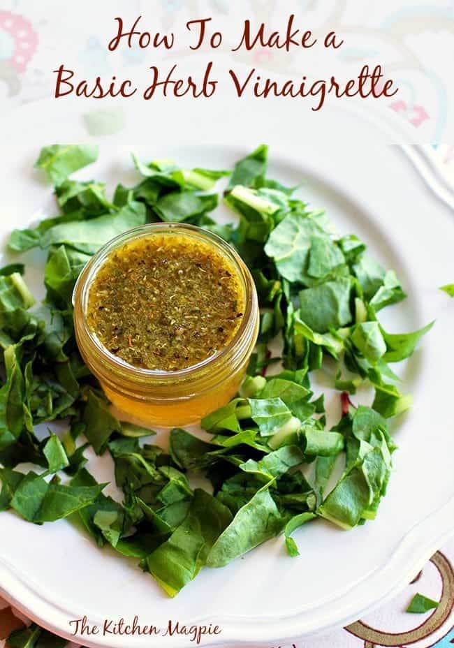 top down shot of Homemade Herb Vinaigrette Recipe in a container, chopped green leaves around it