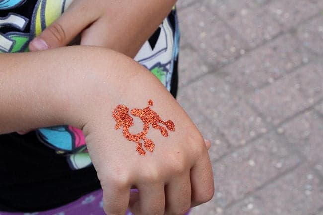 Glitter tattoos on kid's hand