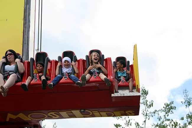 children at the free fallin' ride with faces of joy