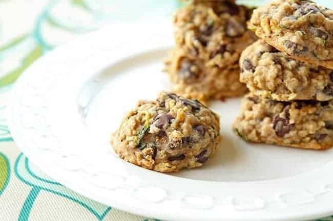 Zucchini Oatmeal Chocolate Chip Cookies on a white plate upon table with a tablecloth