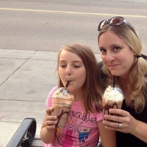 mother and daughter holding their milkshakes at the Downtown Diner