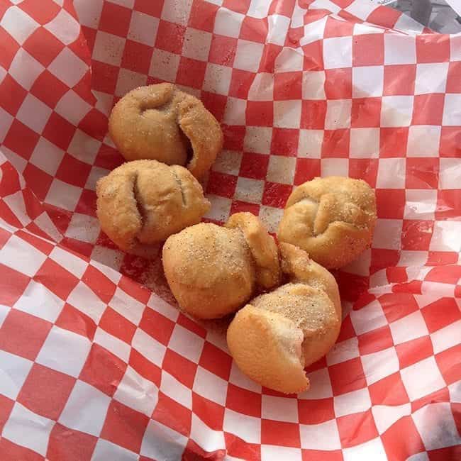 pieces of deep-fried cookie dough in a checkered red linen