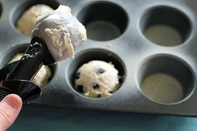 plopping the cookie dough into muffin tins