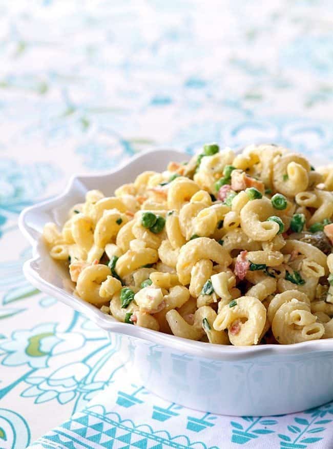 Classic Retro Picnic Macaroni Salad with frozen peas in a white bowl