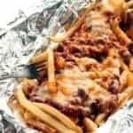 close up of Campfire Chili Cheese Fries in tin foil