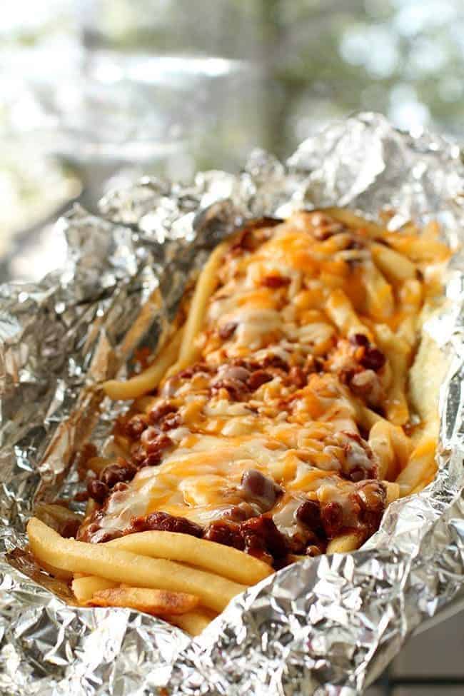 close up of Campfire Chili Cheese Fries in tin foil 