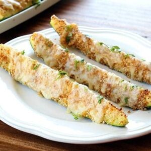 Cheesy & Crunchy Tex-Mex Baked Zucchini Sticks in a White Plate