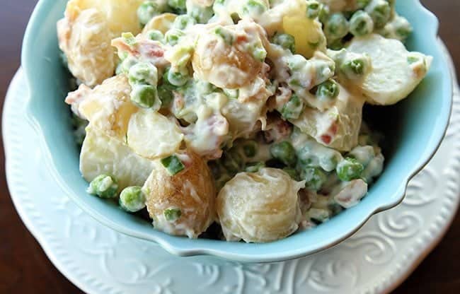 Pea Salad with potatoes, garlic and bacon Aioli in a blue bowl