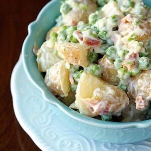 Pea Salad with potatoes, garlic and bacon Aioli in a blue bowl