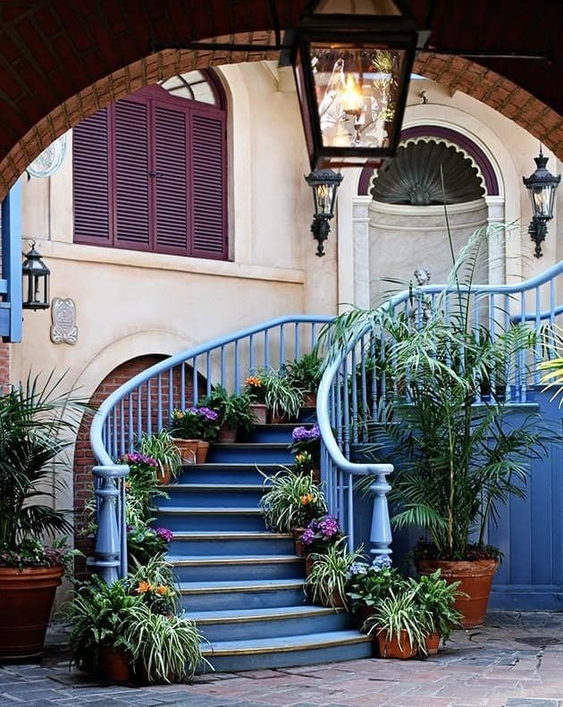 closer view of Court des Anges at Disneyland - blue painted stair with pot of plants in each step