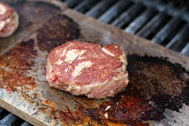 Grilling a piece of steak in a grilling stone