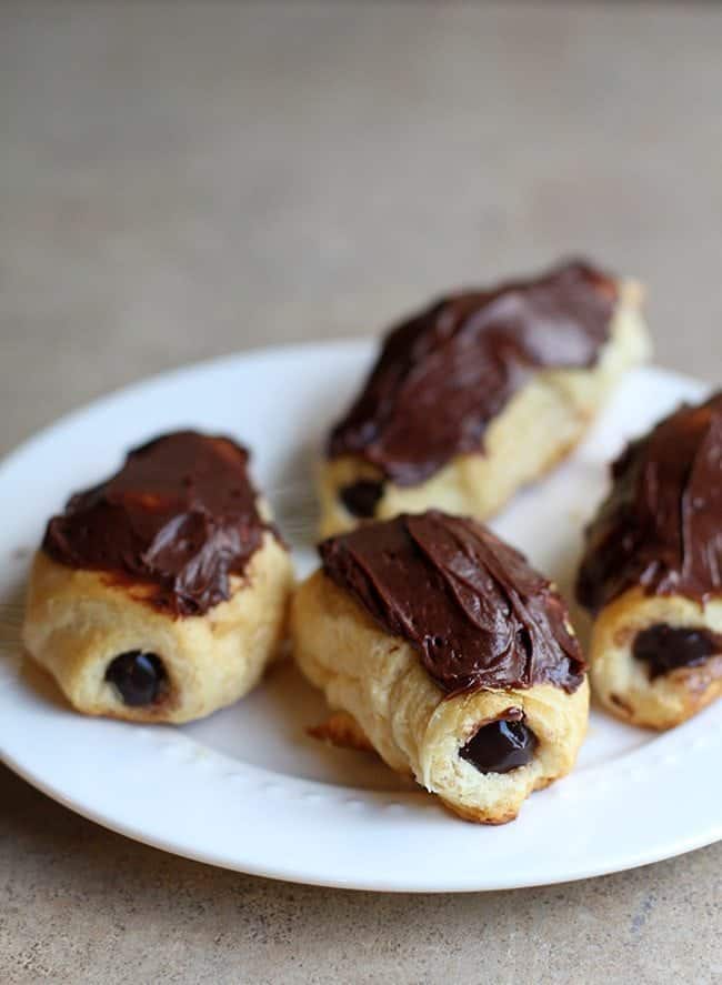 baked eclairs with chocolate pudding in the center and topped with chocolate icing