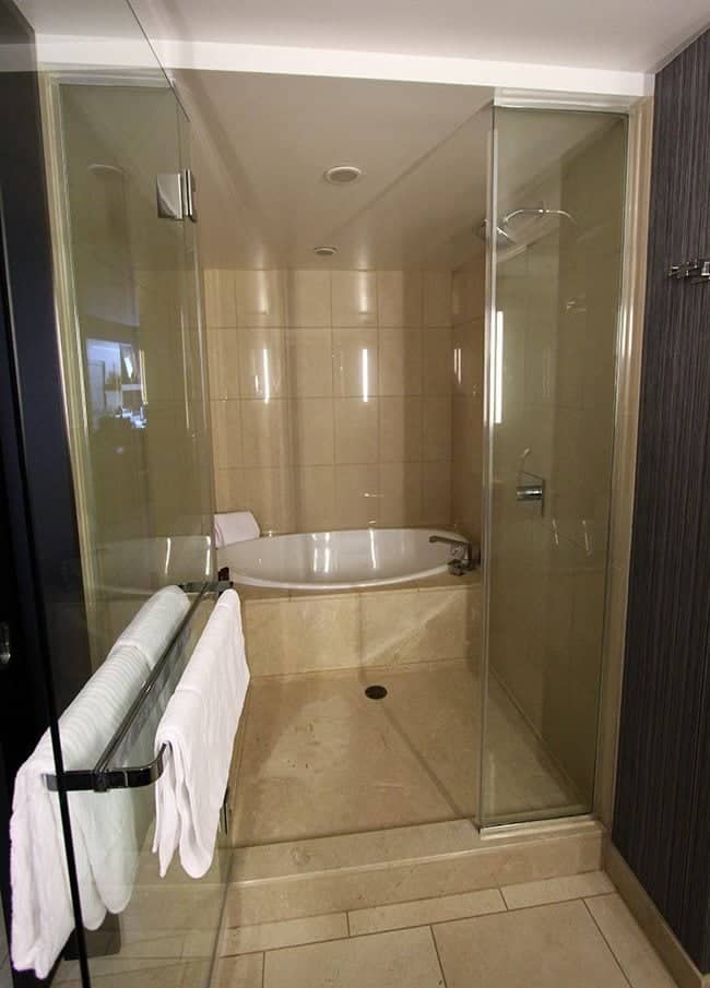 the shower tub combo in the large bathroom