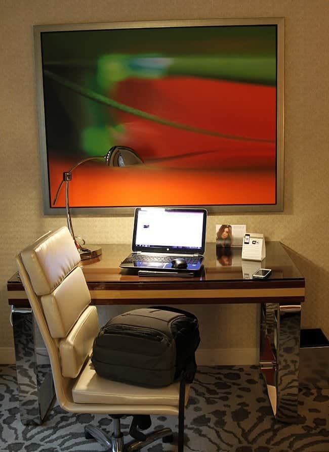 the desk inside the room with the laptop on top