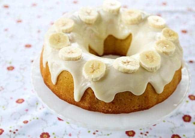 Banana Pudding Cake With Cream Cheese Glaze and sliced banana toppings