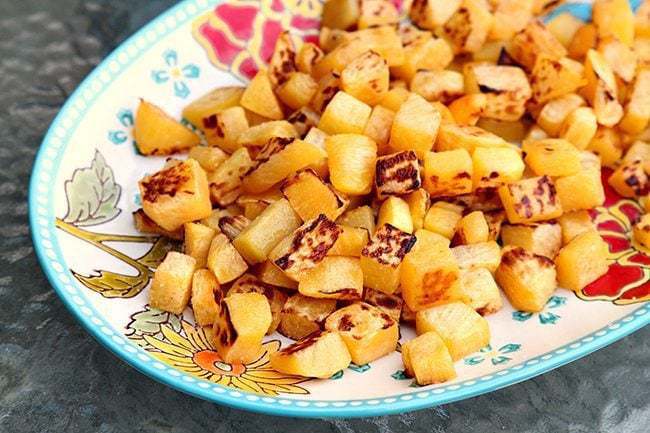 Sea Salt & Olive Oil Roasted Turnips in a plate with sunflower design