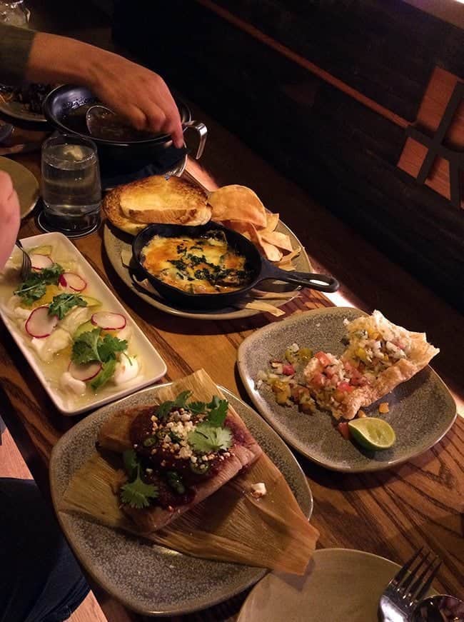 CEVICHE DE ROBALO, QUESO FUNDIDO, TAMALES and FRIJOLES CHARROS on the table