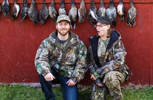 man and woman in their hunting gear not yet ready for picture