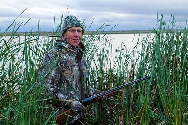 man wearing his hunting gear for duck hunting