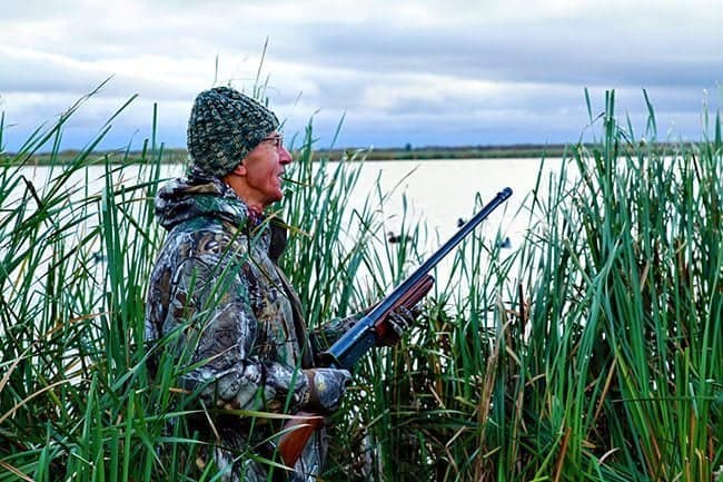 man wearing his hunting gear for duck hunting