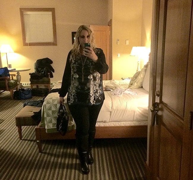 a selfie picture of a woman inside her room