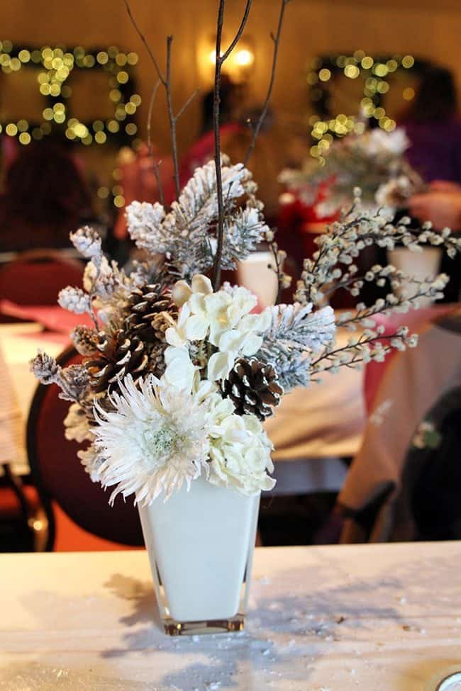 Christmas craft arrangement with white flower in a vase