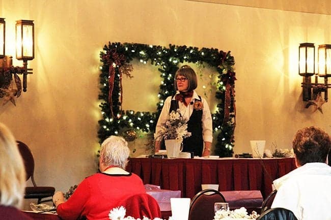 woman in standing in front of table ready for presentation