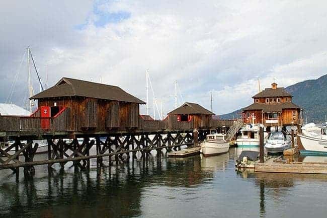 long dock with wooden buildings 