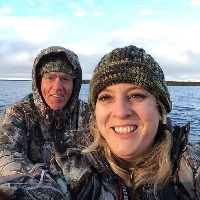 dad and daughter on the boat during duck hunting