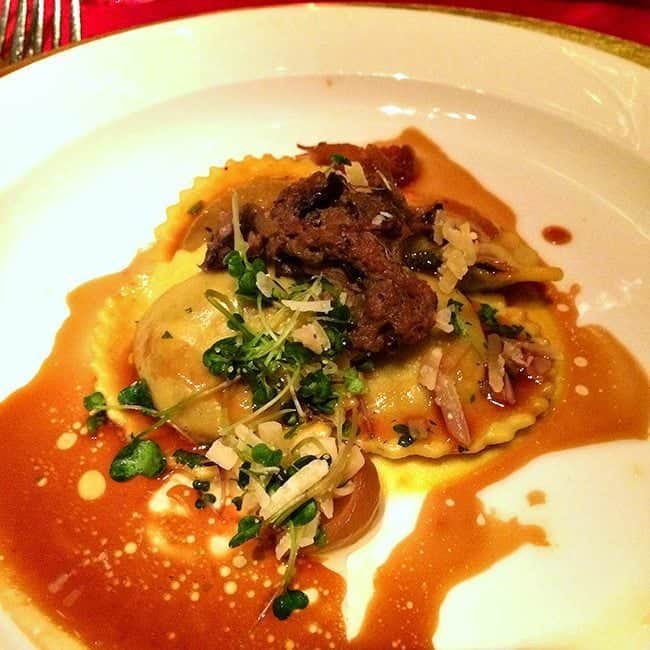 ravioli with braised beef short rib, wild mushroom ragout and Sylvan Star Gouda in a White Plate