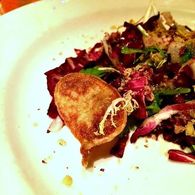 a plate of crispy endive, radicchio and frisee salad