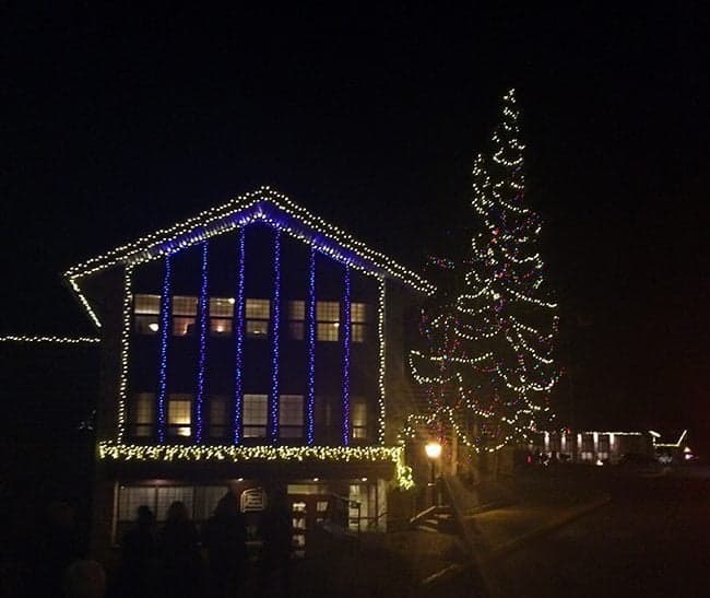 view of lodge during the night when lights are up