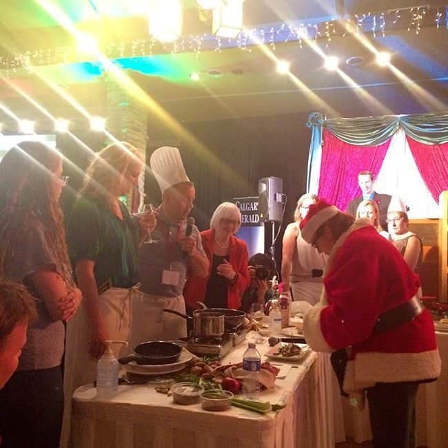 Santa chef in the table of presentation with some participants