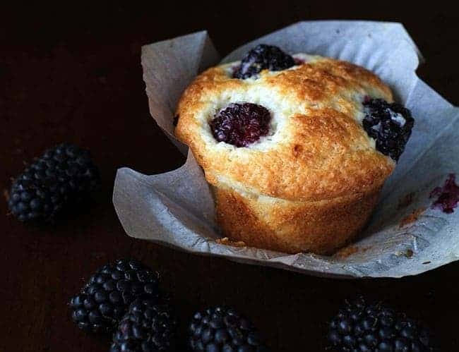 Lemon Blackberry Muffins with Muffin Liner on Dark Background