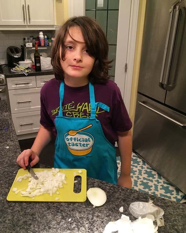 boy in the kitchen chopping the onions for Meatloaf From Campbell's Soup