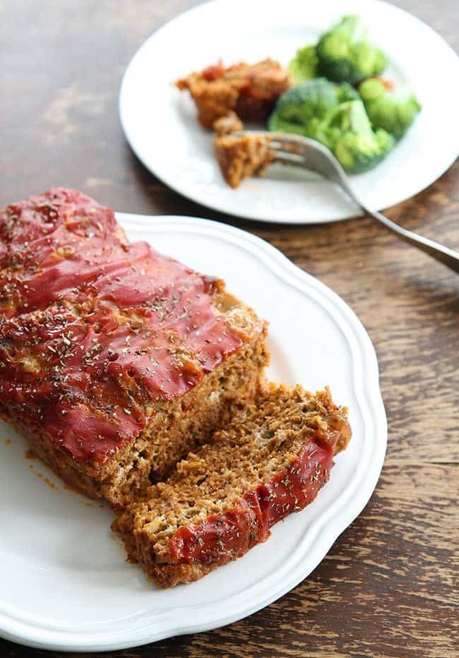 Our Favourite Meatloaf in white plates with Canned Soup Topping