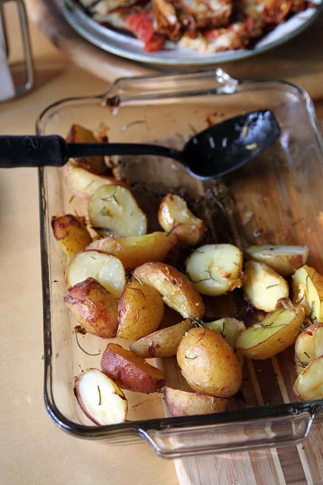 Roasted Garlic Rosemary Potatoes in a Pyrex baking dish ready to enjoy!