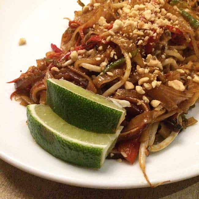 white plate with pig's ear pad thai